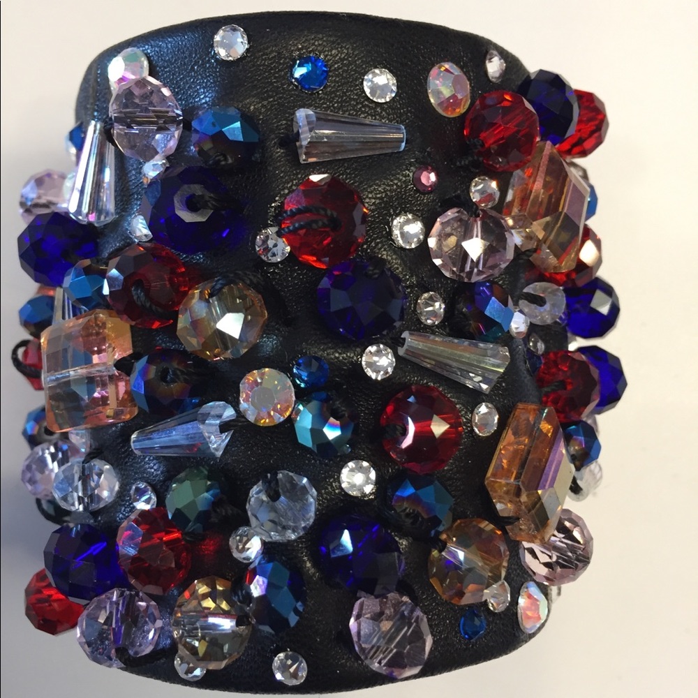 Leather , Chinese, German and Swarovski Crystals.